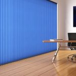 Bright blue vertical blinds in a office space