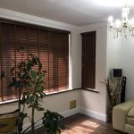 Brown shutter blinds in a living room