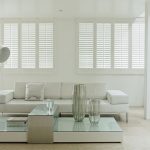 White shutter blinds in a white living room