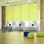 Bright lime green roller blinds in a big office space