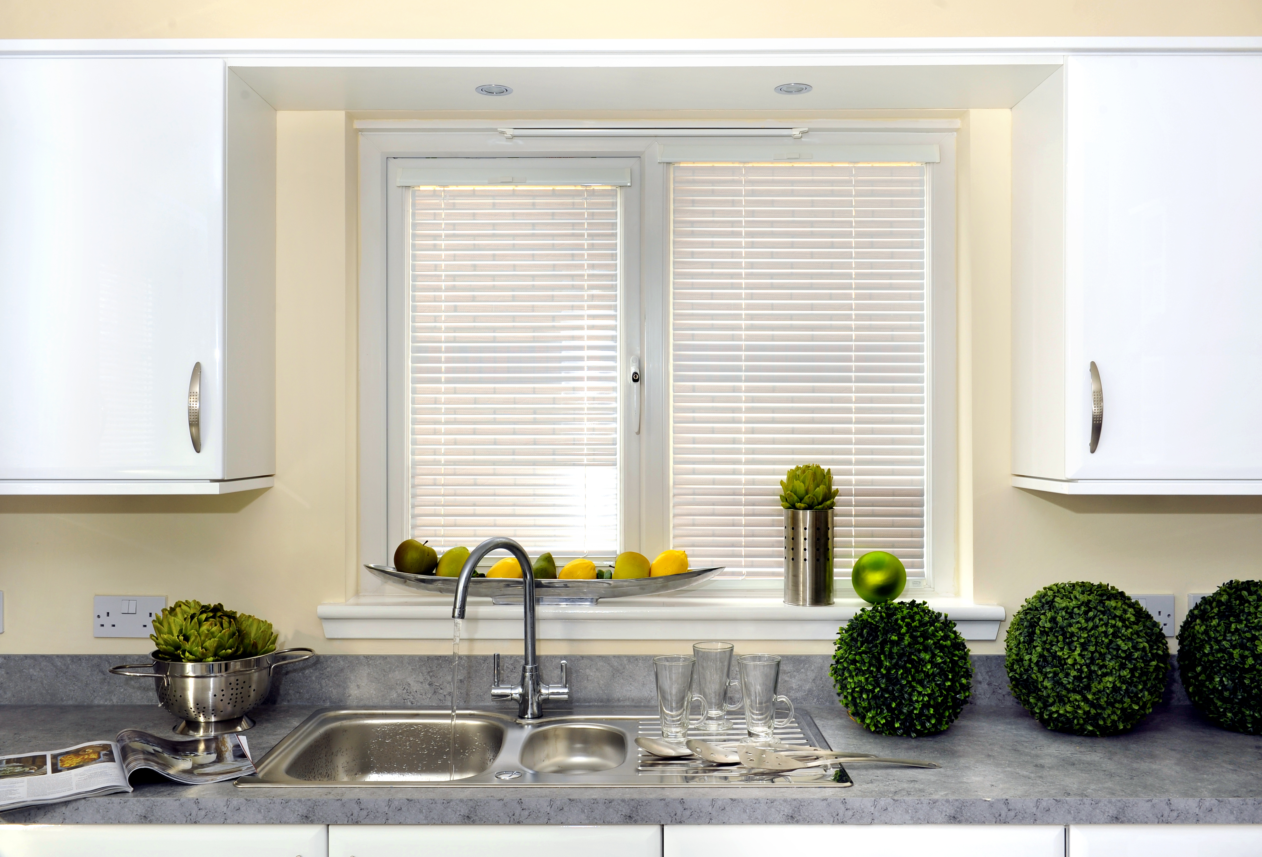 Window blinds Coventry. White venetian blinds by kitchen sink.