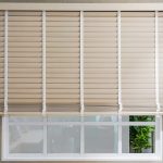 Natural wood blinds. Made to measure Venetian blinds Coventry. Blinds partially pulled up with cord mechanism.